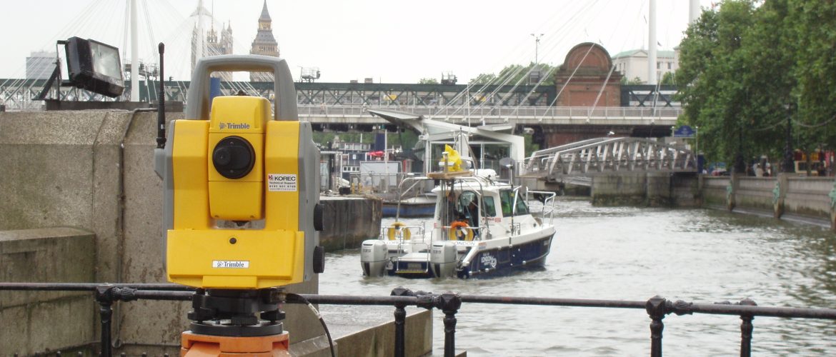 Trimble total station in use to check the accuracy of laser scanning on a boat